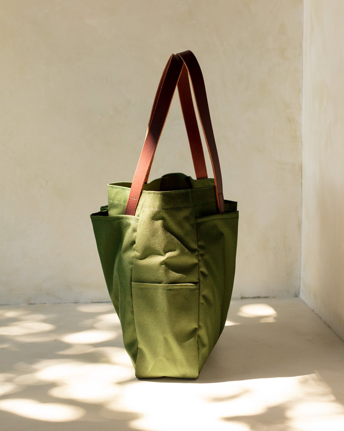 Leather-trimmed printed twill tote